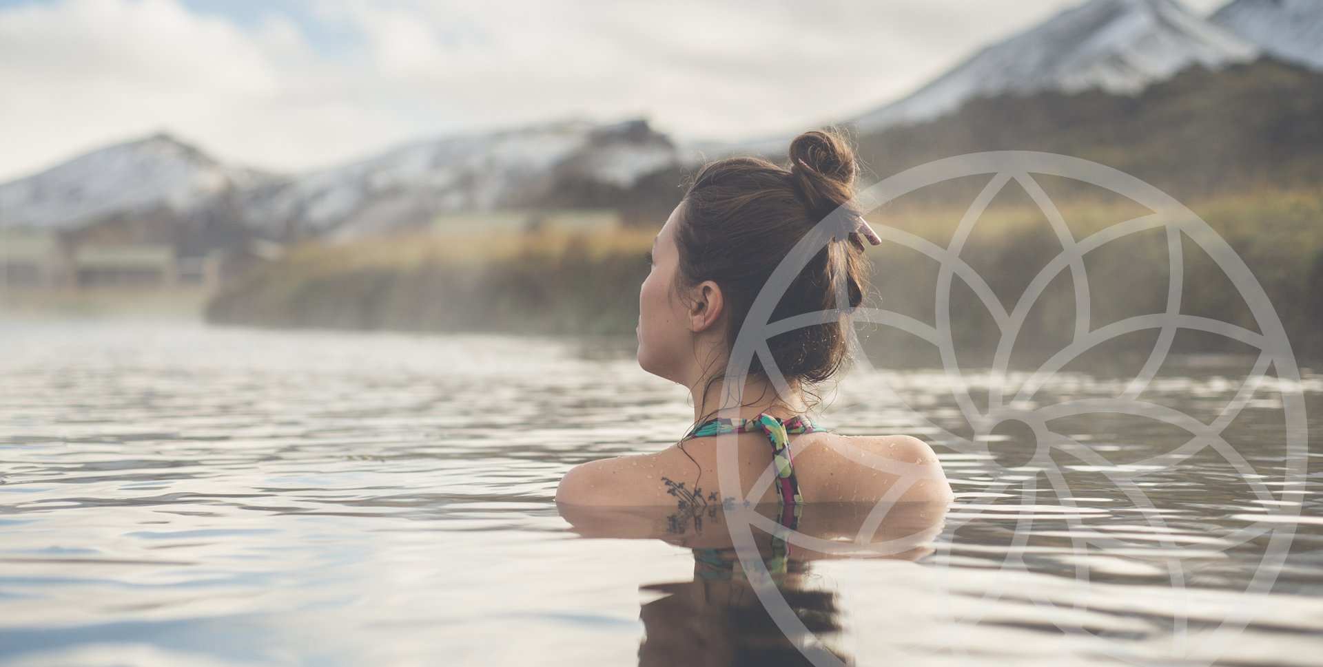 Girl soaking in water with mountain view feeling empowered Alise Body Care